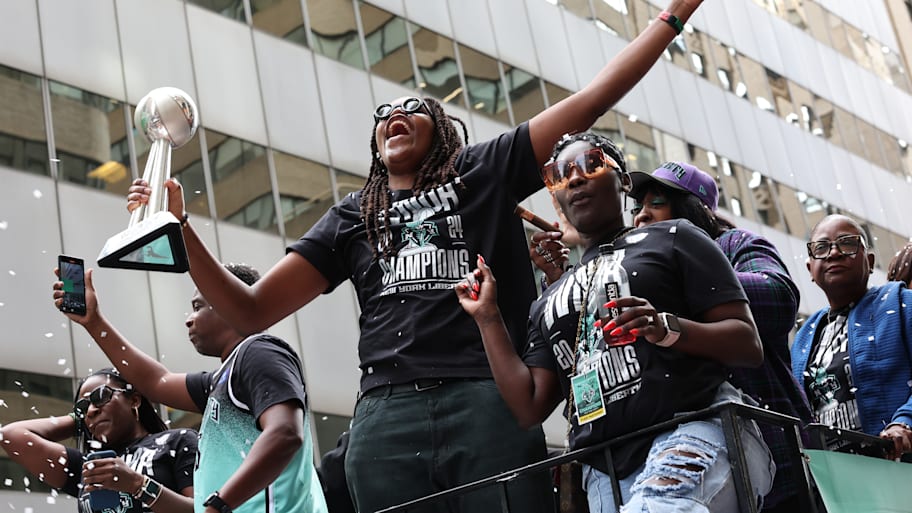 WNBA Finals MVP Jonquel Jones celebrates the team winning the WNBA championship during their parade.