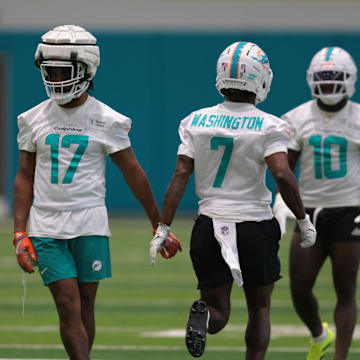 Jul 23, 2025; Miami Gardens, FL, USA; Miami Dolphins wide receiver Jaylen Waddle (17) and wide receiver Tahj Washington (7) work during training camp at Baptist Health Training Complex. 
