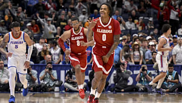 Mar 15, 2025; Nashville, TN, USA;  Alabama Crimson Tide guard Labaron Philon (0) reacts after a made three point basket  against the Florida Gators during the first half at Bridgestone Arena. Mandatory Credit: Steve Roberts-Imagn Images