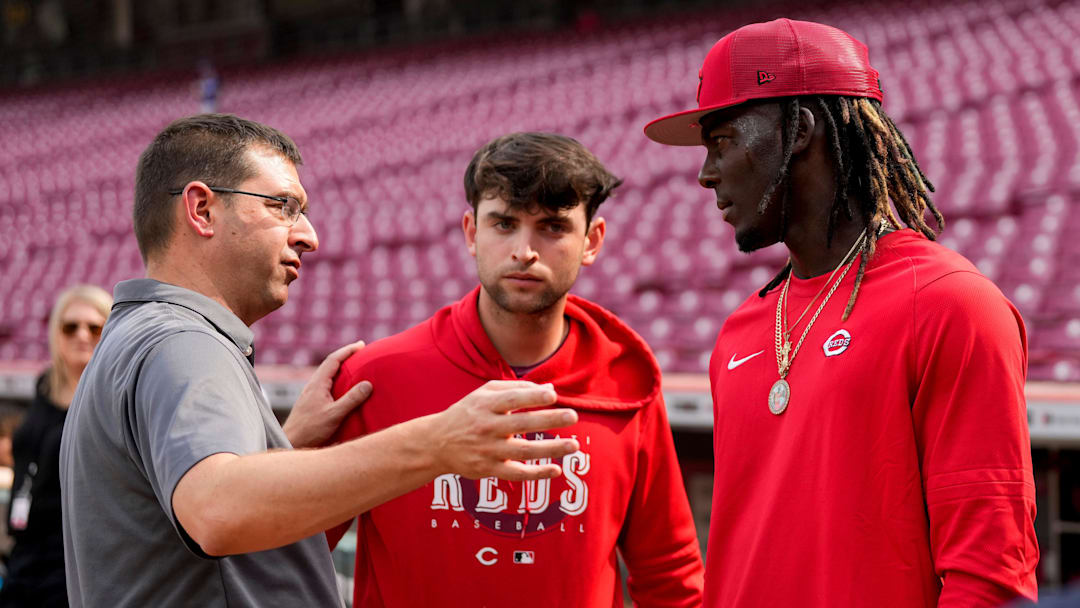 Cincinnati Reds general manager Nick Krall talks with third baseman Elly De La Cruz (44) during batting practice before the MLB National League game between the Cincinnati Reds and the LA Dodgers at Great American Ball Park in downtown Cincinnati on Tuesday, June 6, 2023.