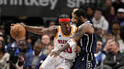 Feb 12, 2025; Dallas, Texas, USA; Golden State Warriors forward Jimmy Butler (10) attempts to move to the basket past Dallas Mavericks guard Kyrie Irving (11) during the second half at the American Airlines Center. Mandatory Credit: Jerome Miron-Imagn Images