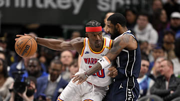Feb 12, 2025; Dallas, Texas, USA; Golden State Warriors forward Jimmy Butler (10) attempts to move to the basket past Dallas Mavericks guard Kyrie Irving (11) during the second half at the American Airlines Center. Mandatory Credit: Jerome Miron-Imagn Images