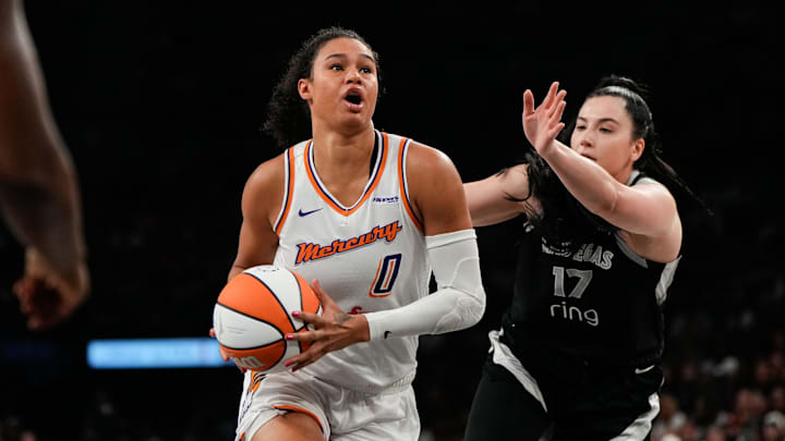 Oct 5, 2025; Las Vegas, Nevada, USA; Phoenix Mercury forward Satou Sabally (0) drives the ball against Megan Gustafson (17) during the second quarter of game two of the 2025 WNBA Finals at Michelob Ultra Arena. Mandatory Credit: Lucas Peltier-Imagn Images Oct 5, 2025; Las Vegas, Nevada, USA; Phoenix Mercury forward Satou Sabally (0) drives the ball against Megan Gustafson (17) during the second quarter of game two of the 2025 WNBA Finals at Michelob Ultra Arena. Mandatory Credit: Lucas Peltier-Imagn Images
