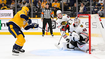 Jan 16, 2025; Nashville, Tennessee, USA;  Chicago Blackhawks goaltender Arvid Soderblom (40) blocks the shot of Nashville Predators center Colton Sissons (10) during the third period at Bridgestone Arena. Mandatory Credit: Steve Roberts-Imagn Images