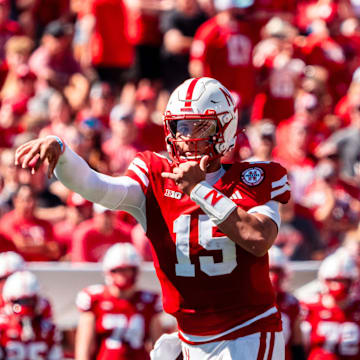 Aug 31, 2024; Lincoln, Nebraska, USA; Nebraska Cornhuskers quarterback Dylan Raiola (15) throws to wide receiver Isaiah Neyor (18) against the UTEP Miners during the second quarter at Memorial Stadium.