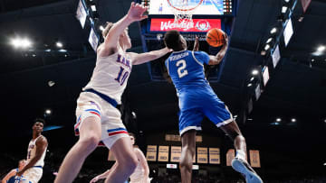 Feb 27, 2024; Lawrence, Kansas, USA; Brigham Young Cougars guard Jaxson Robinson (2) shoots as