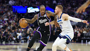 Oct 24, 2024; Sacramento, California, USA; Sacramento Kings forward DeMar DeRozan (10) dribbles the ball against Minnesota Timberwolves guard Donte DiVincenzo (0) during the second quarter at Golden 1 Center. Mandatory Credit: Sergio Estrada-Imagn Images