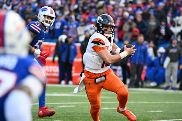 Denver Broncos quarterback Bo Nix runs for a gain during the fourth quarter against the Buffalo Bills