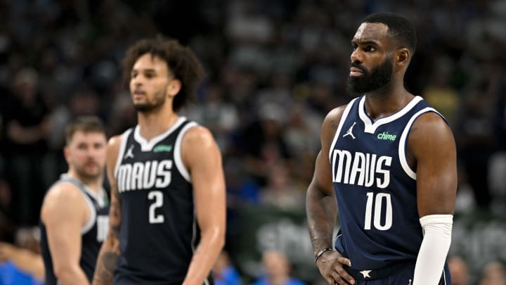 May 13, 2024; Dallas, Texas, USA; Dallas Mavericks guard Luka Doncic (77) and center Dereck Lively II (2) and forward Tim Hardaway Jr. (10) look on during the second half against the Oklahoma City Thunder in game four of the second round for the 2024 NBA playoffs at American Airlines Center. Mandatory Credit: Jerome Miron-USA TODAY Sports