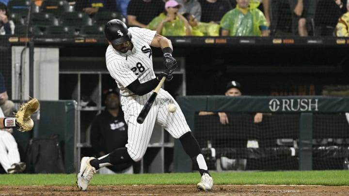 Jun 27, 2024; Chicago, Illinois, USA;  Chicago White Sox outfielder Tommy Pham (28) hits a two RBI single during the sixth inning against the Colorado Rockies at Guaranteed Rate Field. Mandatory Credit: Matt Marton-USA TODAY Sports