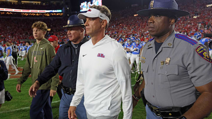 Nov 15, 2025; Oxford, Mississippi, USA; Mississippi Rebels head coach Lane Kiffin  walks onto the field after defeating the Florida Gators at Vaught-Hemingway Stadium. Mandatory Credit: Petre Thomas-Imagn Images