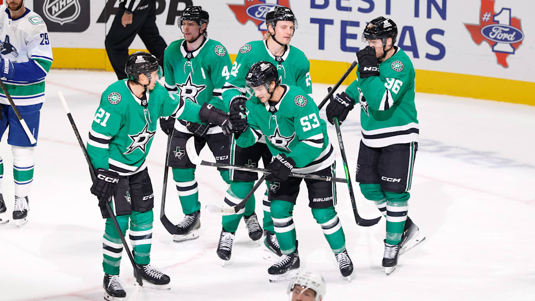 Oct 16, 2025; Dallas, Texas, USA; Dallas Stars center Wyatt Johnston (53) celebrates with teammates after scoring a goal against the Vancouver Canucks during the third period at American Airlines Center. Mandatory Credit: Chris Jones-Imagn Images
