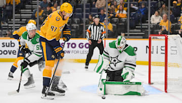 Oct 26, 2025; Nashville, Tennessee, USA;  Dallas Stars goaltender Casey Desmith (1) blocks the shot of Nashville Predators right wing Michael McCarron (47) during the third period at Bridgestone Arena. Mandatory Credit: Steve Roberts-Imagn Images