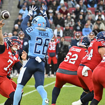 Nov 11, 2023; Toronto, Ontario, CAN;  Montreal Alouettes quarterback Cody Fajardo (7) throws the ball past Toronto Argonauts defensive back Mason Pierce (28) in the first half at BMO Field. Mandatory Credit: Dan Hamilton-Imagn Images