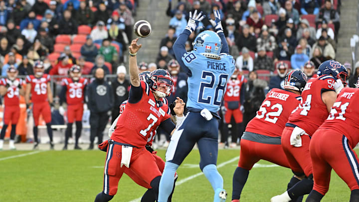 Nov 11, 2023; Toronto, Ontario, CAN;  Montreal Alouettes quarterback Cody Fajardo (7) throws the ball past Toronto Argonauts defensive back Mason Pierce (28) in the first half at BMO Field. Mandatory Credit: Dan Hamilton-Imagn Images