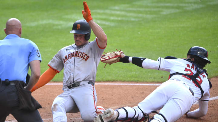 Jul 6, 2024; Cleveland, Ohio, USA; San Francisco Giants third baseman Matt Chapman (26) steals home beside Cleveland Guardians catcher Bo Naylor (23) in the fifth inning at Progressive Field.