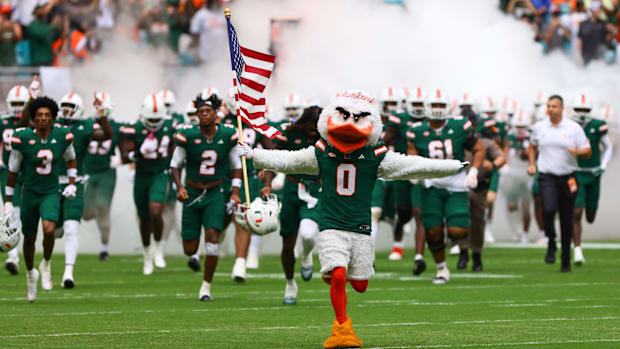 Nov 2, 2024; Miami Gardens, Florida, USA; Miami Hurricanes mascot Sebastian the Ibis leads the team onto the field before the