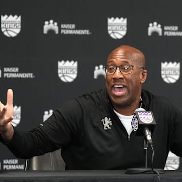 Dec 8, 2024; Sacramento, California, USA; Sacramento Kings head coach Mike Brown talks to media members before the game against the Utah Jazz at Golden 1 Center. Mandatory Credit: Darren Yamashita-Imagn Images