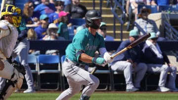 Mar 9, 2024; Phoenix, Arizona, USA; Seattle Mariners second base Cole Young (92) hits against the Milwaukee Brewers in the second inning at American Family Fields of Phoenix. Mandatory Credit: Rick Scuteri-USA TODAY Sports