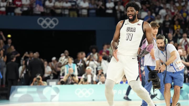 Aug 8, 2024; Paris, France; United States centre Joel Embiid (11) celebrates after the game against Serbia in a men's basketball semifinal game during the Paris 2024 Olympic Summer Games at Accor Arena. M