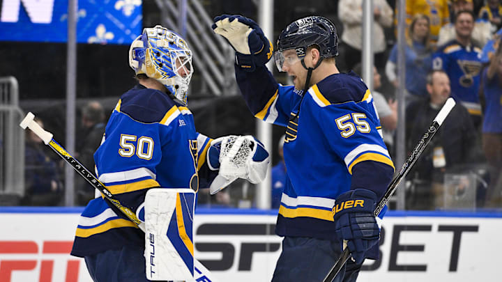 Apr 24, 2025; St. Louis, Missouri, USA; St. Louis Blues defenseman Colton Parayko (55) and goaltender Jordan Binnington (50) celebrate after the Blues defeated the Winnipeg Jets in game three of the first round of the 2025 Stanley Cup Playoffs at Enterprise Center. Mandatory Credit: Jeff Curry-Imagn Images