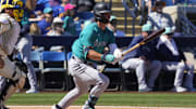 Seattle Mariners second baseman Cole Young hits against the Milwaukee Brewers in a spring training game March 9, 2024, at American Family Fields of Phoenix.