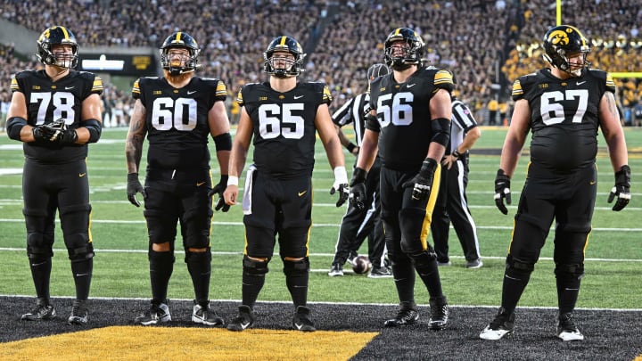 Sep 30, 2023; Iowa City, Iowa, USA; Iowa Hawkeyes offensive lineman Mason Richman (78) and offensive lineman Rusty Feth (60) and offensive lineman Logan Jones (65) and offensive lineman Nick DeJong (56) and offensive lineman Gennings Dunker (67) look on during the first quarter against the Michigan State Spartans at Kinnick Stadium. Mandatory Credit: Jeffrey Becker-USA TODAY Sports