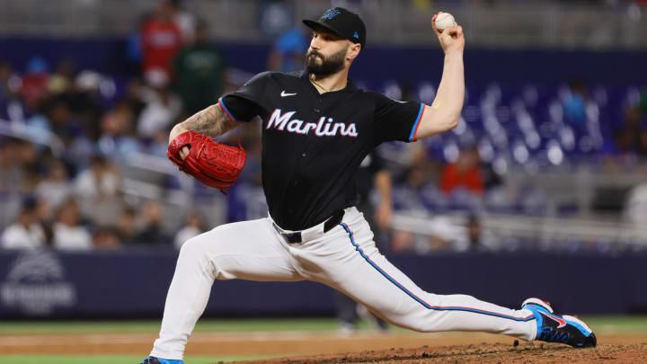 Jul 19, 2024; Miami, Florida, USA; Miami Marlins relief pitcher Tanner Scott (66) delivers a pitch against the New York Mets during the ninth inning at loanDepot Park.