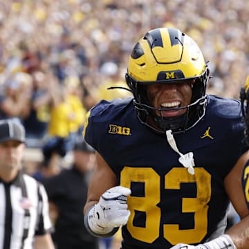 Oct 18, 2025; Ann Arbor, Michigan, USA;  Michigan Wolverines tight end Zack Marshall (83) celebrates with teammates after scoring a touchdown in the second half against the Washington Huskies at Michigan Stadium. Mandatory Credit: Rick Osentoski-Imagn Images