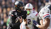 Nov 15, 2025; Cincinnati, Ohio, USA;  Cincinnati Bearcats quarterback Brendan Sorsby (2) runs with the ball against the Arizona Wildcats in the second half at Nippert Stadium. Mandatory Credit: Aaron Doster-Imagn Images