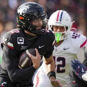 Nov 15, 2025; Cincinnati, Ohio, USA;  Cincinnati Bearcats quarterback Brendan Sorsby (2) runs with the ball against the Arizona Wildcats in the second half at Nippert Stadium. Mandatory Credit: Aaron Doster-Imagn Images