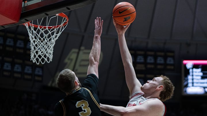 Mar 7, 2026; West Lafayette, Indiana, USA; Wisconsin Badgers forward Austin Rapp (22) attempts to dunk the ball as Purdue Boilermakers guard Braden Smith (3) defends during the first half at Mackey Arena. Mandatory Credit: Jacob Musselman-Imagn Images