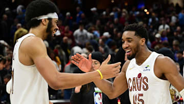 Jan 8, 2025; Cleveland, Ohio, USA; Cleveland Cavaliers guard Donovan Mitchell (45) celebrates with center Jarrett Allen (31) after the Cavaliers beat the Oklahoma City Thunder at Rocket Mortgage FieldHouse. Mandatory Credit: Ken Blaze-Imagn Images