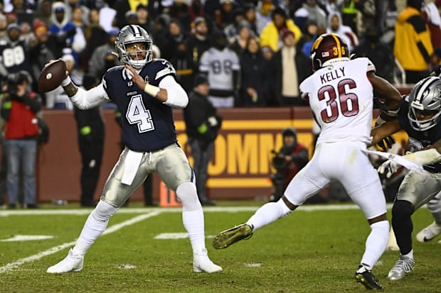Dallas Cowboys QB Dak Prescott attempts a pass against the Washington Commanders during the second half at FedExField.