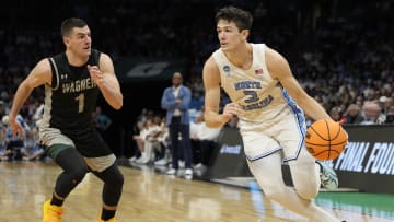 March 21, 2024, Charlotte, NC, USA; North Carolina Tar Heels guard Cormac Ryan (3) drives against Wagner Seahawks guard Javier Ezquerra (1) in the first round of the 2024 NCAA Tournament at the Spectrum Center. 