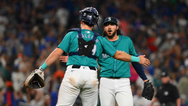 Seattle Mariners catcher Cal Raleigh (29) and relief pitcher Andres Munoz (75) celebrate defeating the New York Mets at T-Mobile Park on Aug 10.