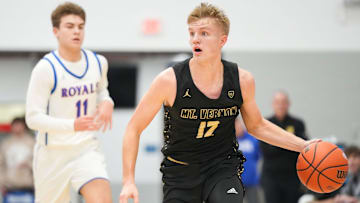 Mt. Vernon Marauders guard Luke Ertel (12) rushes up the court 
