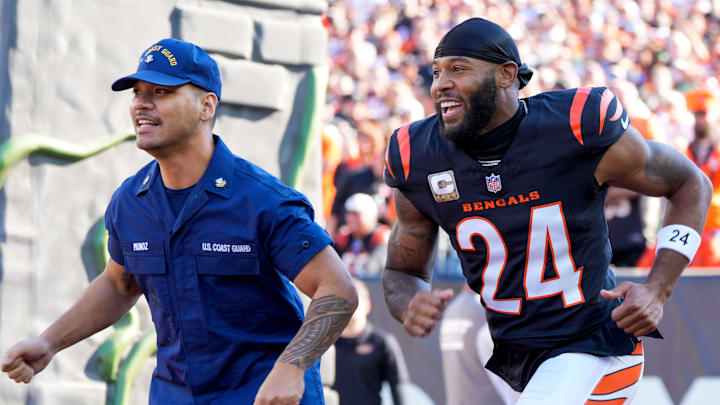 Cincinnati Bengals safety Vonn Bell (24) takes the field with his Salute to Service escort before the first quarter of the NFL Week 9 game between the Cincinnati Bengals and the Las Vegas Raiders at Paycor Stadium in downtown Cincinnati on Sunday, Nov. 3, 2024.