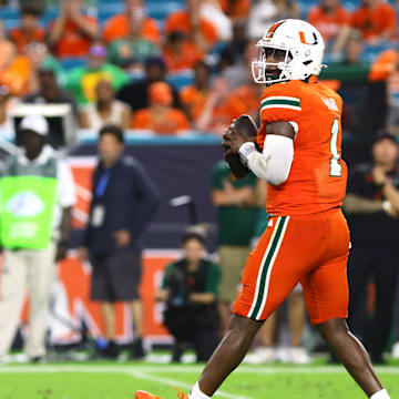 Sep 7, 2024; Miami Gardens, Florida, USA; Miami Hurricanes quarterback Cam Ward (1) drops back to pass against the Florida A&M Rattlers during the third quarter at Hard Rock Stadium. Mandatory Credit: Sam Navarro-Imagn Images