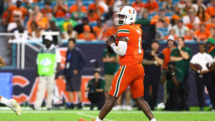 Sep 7, 2024; Miami Gardens, Florida, USA; Miami Hurricanes quarterback Cam Ward (1) drops back to pass against the Florida A&M Rattlers during the third quarter at Hard Rock Stadium. Mandatory Credit: Sam Navarro-Imagn Images