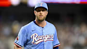 Aug 24, 2025; Arlington, Texas, USA; Texas Rangers starting pitcher Merrill Kelly (23) comes off the field after he pitches against the Cleveland Guardians during the first inning at Globe Life Field. 