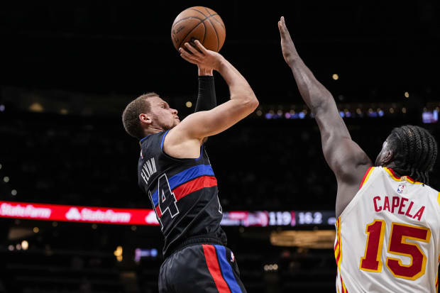 Detroit Pistons guard Malachi Flynn shoots over Atlanta Hawks center Clint Capela during the second half at State Farm Arena.