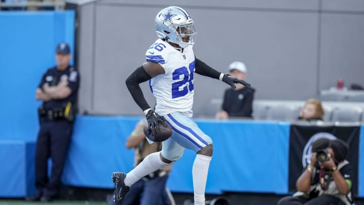 Nov 19, 2023; Charlotte, North Carolina, USA; Dallas Cowboys cornerback DaRon Bland (26) celebrates his score in the end zone against the Carolina Panthers during the second half at Bank of America Stadium. Mandatory Credit: Jim Dedmon-USA TODAY Sports