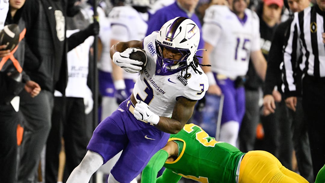Dec 20, 2025; Eugene, OR, USA; James Madison Dukes running back Wayne Knight (3) rushes during the second quarter against the Oregon Ducks at Autzen Stadium. Mandatory Credit: Troy Wayrynen-Imagn Images