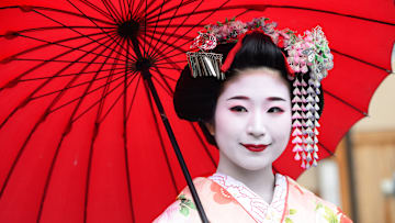 The woman above is technically a maiko, or young geisha in training.