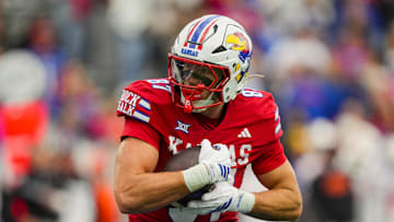 Nov 1, 2025; Lawrence, Kansas, USA; Kansas Jayhawks tight end Leyton Cure (87) runs with the ball during the second half against the Oklahoma State Cowboys at David Booth Kansas Memorial Stadium. Mandatory Credit: Jay Biggerstaff-Imagn Images