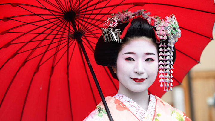 The woman above is technically a maiko, or young geisha in training.