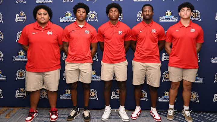 Mater Dei football players pose for a picture at the CIF championship football luncheon in Long Beach.