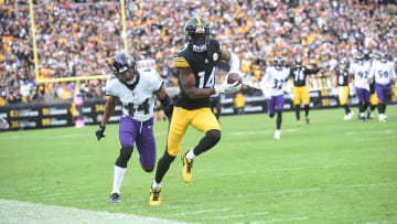 Oct 8, 2023; Pittsburgh, Pennsylvania, USA;  Pittsburgh Steelers wide receiver George Pickens (14) catches a 41 yard pass for a touchdown as Baltimore Ravens cornerback Marion Humphrey (44) applies coverage during the fourth quarter at Acrisure Stadium. The catch was the game-winning score as the Steelers won 17-10.  Mandatory Credit: Philip G. Pavely-USA TODAY Sports