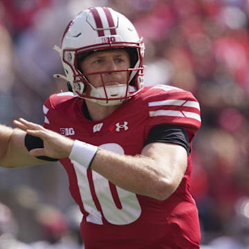 Sep 14, 2024; Madison, Wisconsin, USA;  Wisconsin Badgers quarterback Tyler Van Dyke (10) throws a pass during the first quarter against the Alabama Crimson Tide at Camp Randall Stadium.